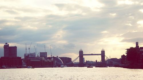 Cityscape against cloudy sky