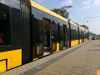 Train on railroad station platform against sky