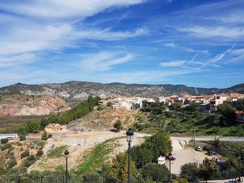 Scenic view of town against sky