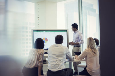 Business people listening to presentation