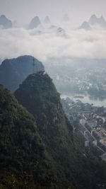 High angle view of buildings and mountains against sky