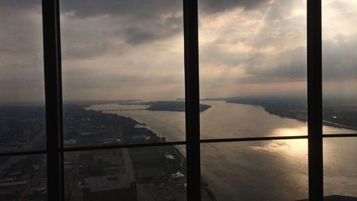 View of cloudy sky seen through window