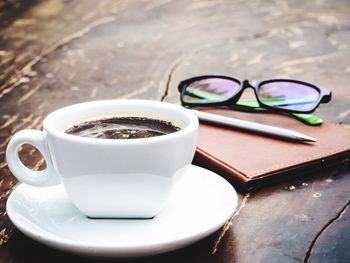 Close-up of coffee cup on table