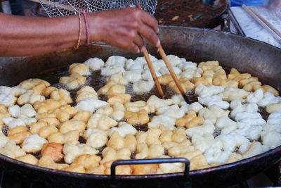 Close-up of person preparing food