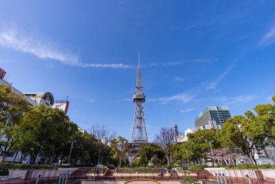 Buildings in city against blue sky