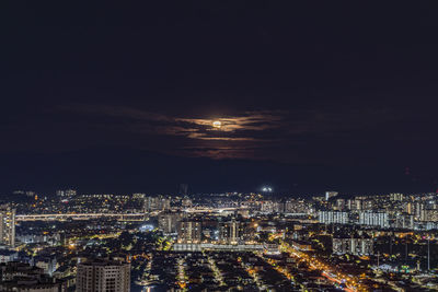 Illuminated cityscape at night