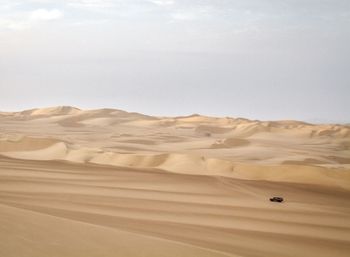 Scenic view of desert against sky