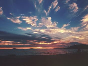 Scenic view of sea against cloudy sky