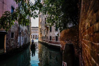 Canal amidst buildings in city