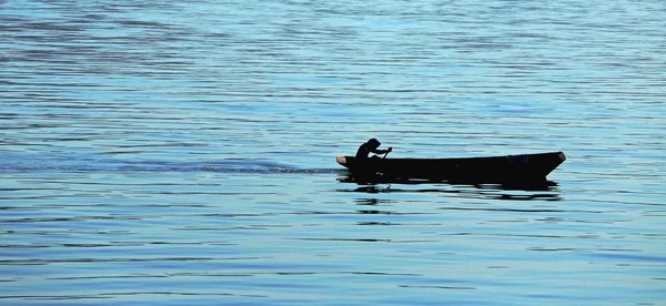 Man in boat on water