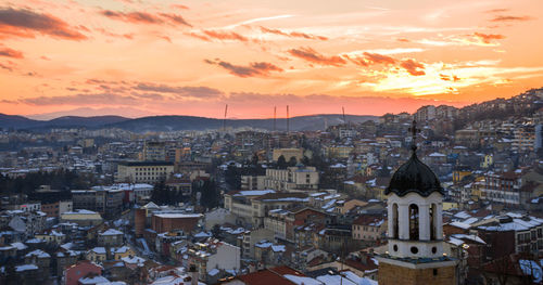 High angle view of city at sunset