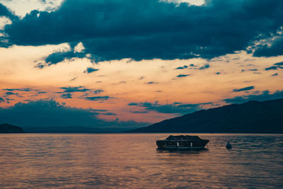 Scenic view of sea against dramatic sky