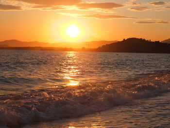 Scenic view of sea against sky during sunset