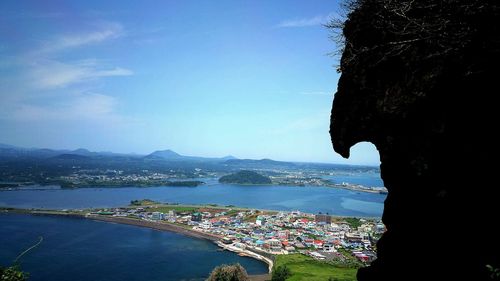 View of sea with cityscape in background