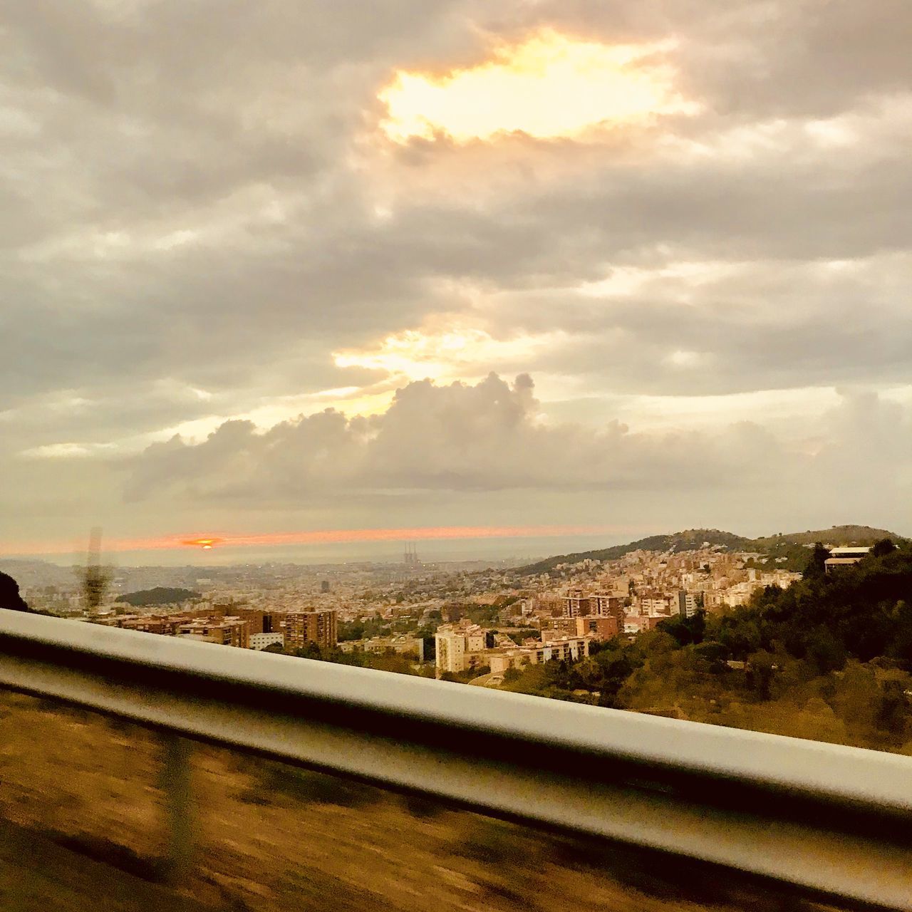 ROAD BY CITY AGAINST SKY