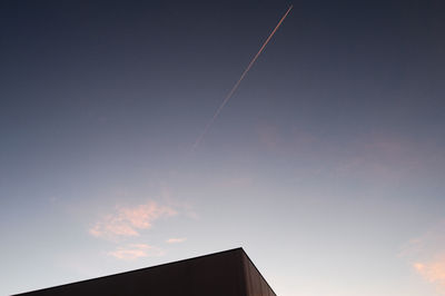 Low angle view of vapor trails in sky