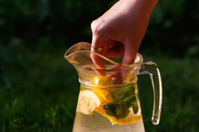 Close-up of hand holding drink