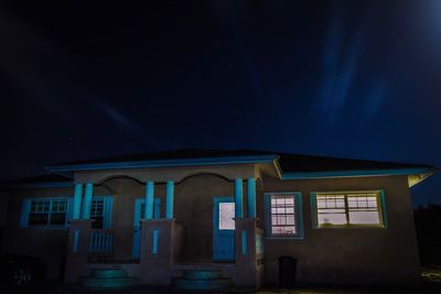 Low angle view of building against sky at night