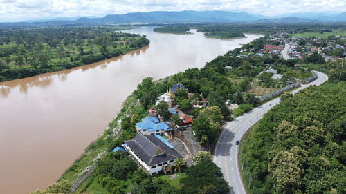 High angle view of townscape by lake