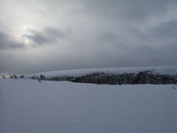 Scenic view of snow against sky during winter