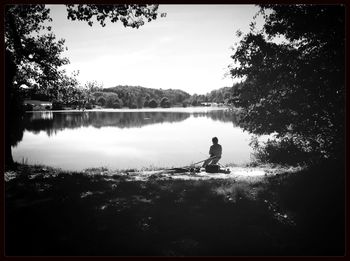 Reflection of trees in calm lake