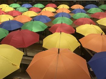 High angle view of multi colored umbrellas at market stall