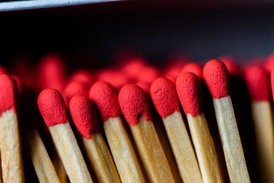 Set of red head phosphor sticks inside the box aligned in parallel