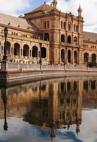 Plaza de espana at sevilla, spain. reflection of building in river. wide angle