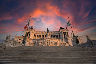 Low angle view of building against sky during sunset