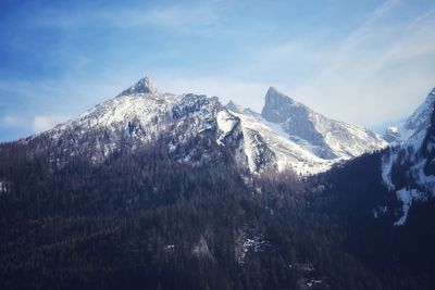 Scenic view of snowcapped mountains against sky