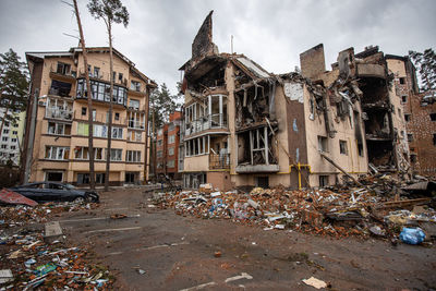 Cities of ukraine after the russian occupation. destroyed buildings on the streets of irpen.