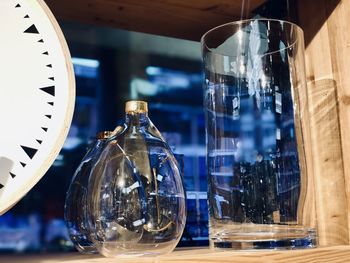 Glass flask glass vases on table