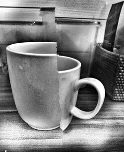 Close-up of coffee cup on table