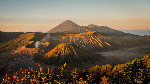 View of volcanic landscape against sky during sunset