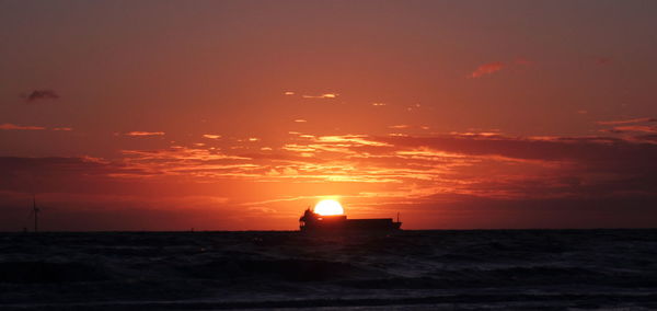 Scenic view of sea at sunset