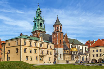 Buildings against cloudy sky