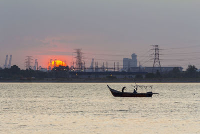 Rustic fishing boat at sunset