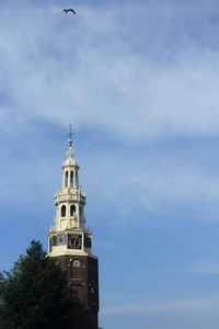 Low angle view of church and building against sky