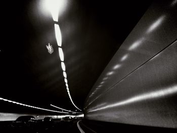 Low angle view of illuminated lights at night