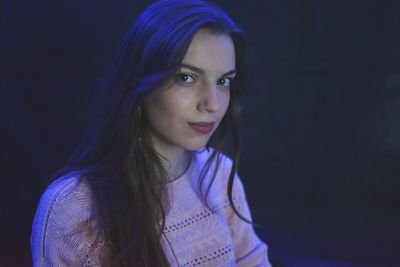 Close-up of young woman at night 