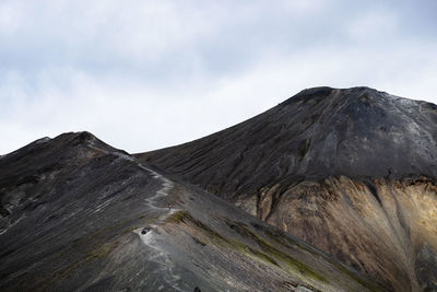 Scenic view of volcanic mountain against sky