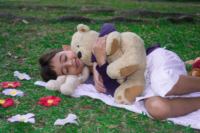 Young woman sleeping on grass