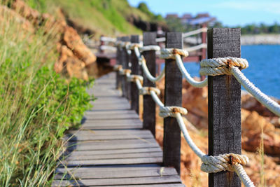 Close-up of rope on wooden post