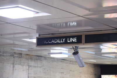 Low angle view of illuminated information sign