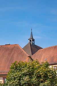 Low angle view of roof and building against sky