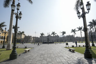 Panoramic view of people on street against clear sky