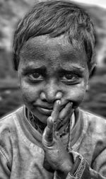 Close-up portrait of messy boy outdoors