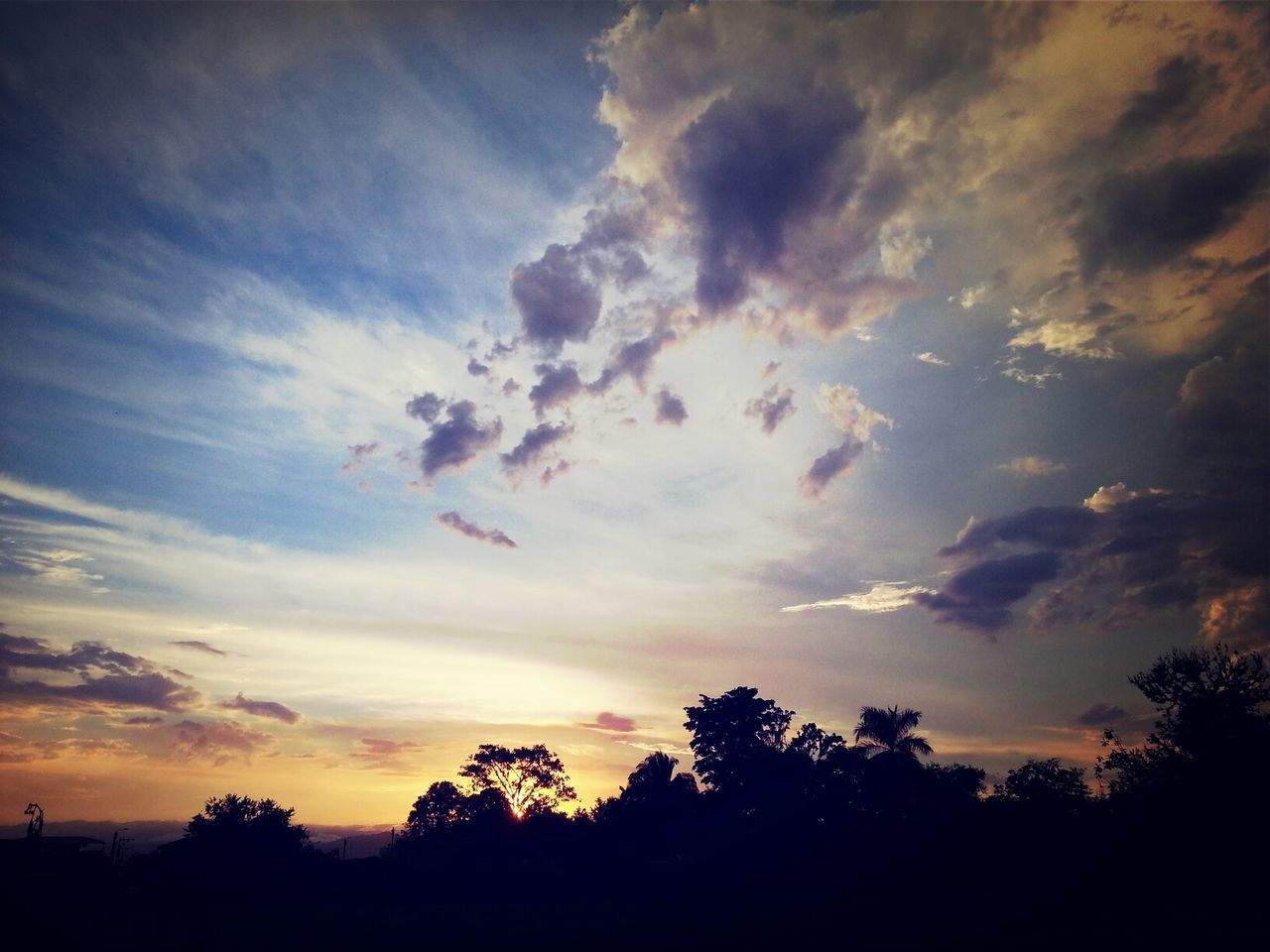 silhouette, sky, sunset, beauty in nature, scenics, cloud - sky, tranquility, tranquil scene, tree, nature, low angle view, cloud, cloudy, dramatic sky, idyllic, orange color, outdoors, majestic, no people, dusk