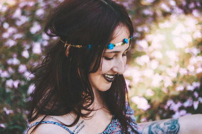 Close-up of beautiful young woman with flowers