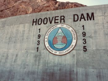 Close-up of information sign on wall